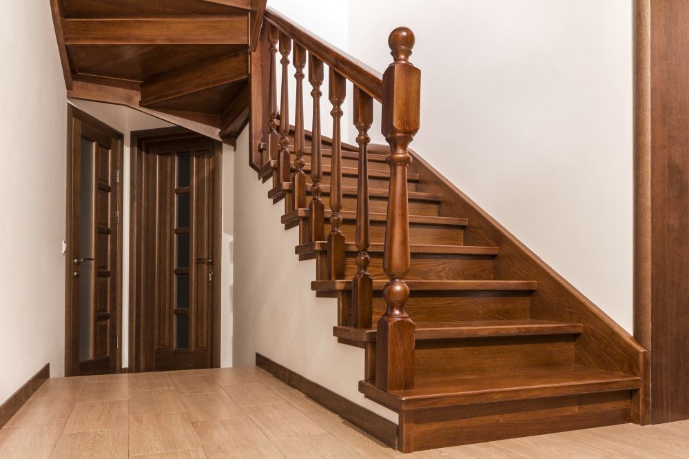 Sturdy handrails installed on both sides of a home staircase for senior safety